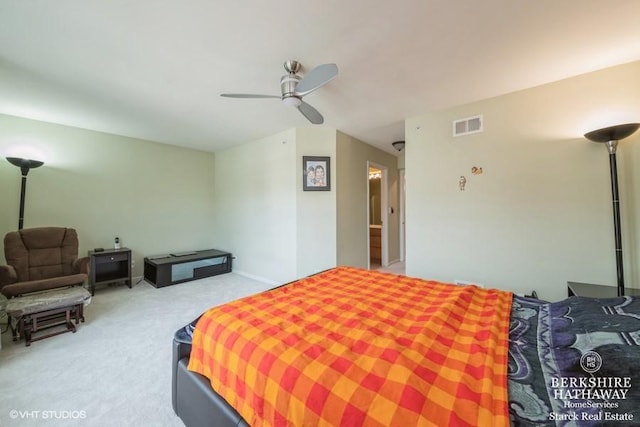 carpeted bedroom with visible vents and ceiling fan