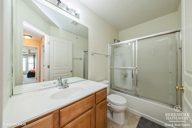 bathroom with tile patterned flooring, visible vents, toilet, shower / bath combination with glass door, and vanity