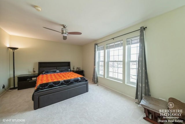 bedroom with carpet flooring, a ceiling fan, and baseboards