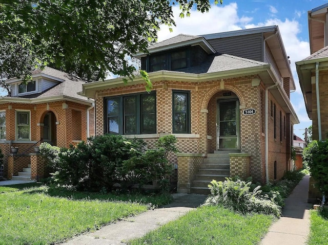 view of front of property featuring brick siding