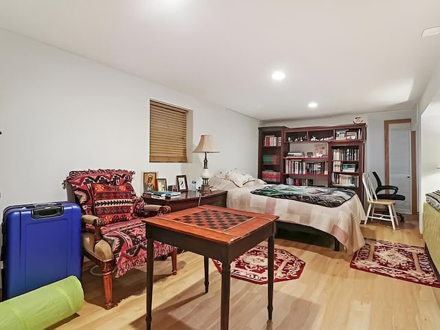 bedroom featuring wood finished floors and recessed lighting