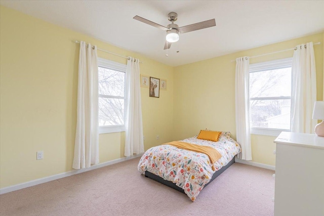 bedroom with baseboards, carpet, and ceiling fan