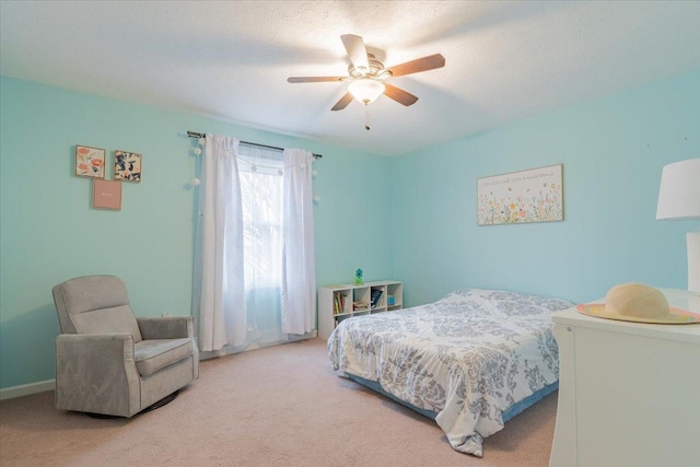 carpeted bedroom featuring a ceiling fan