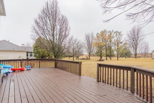 wooden terrace with a yard