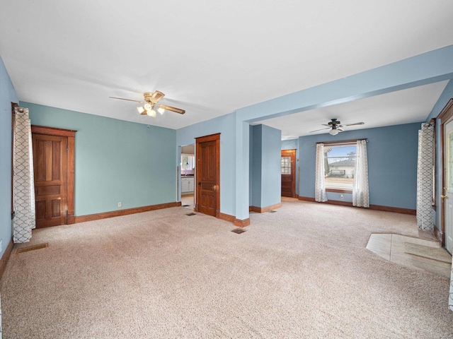 interior space featuring carpet floors and baseboards