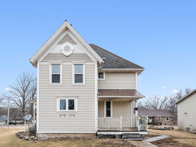 back of house with covered porch