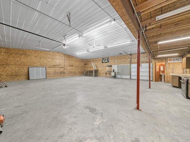 interior space featuring a garage and concrete flooring