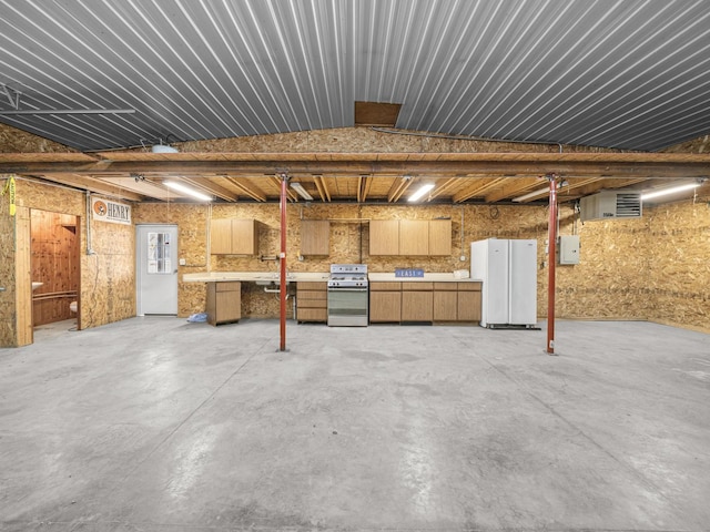 basement featuring freestanding refrigerator