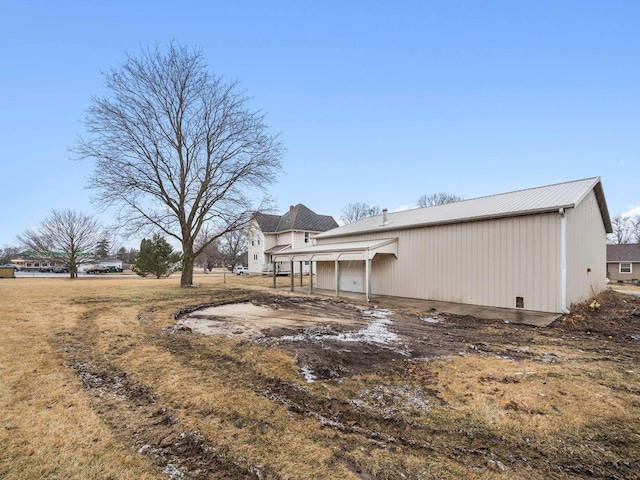 view of home's exterior featuring an outdoor structure and an outbuilding