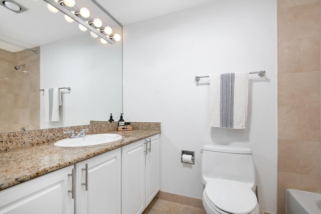 bathroom with tile patterned flooring, toilet, vanity, and baseboards