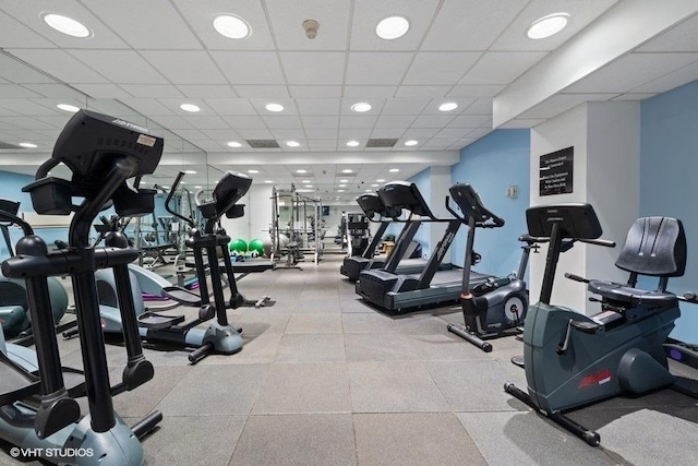 exercise room featuring a drop ceiling