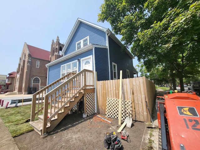 view of property exterior with fence