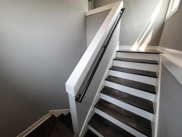 stairway featuring baseboards