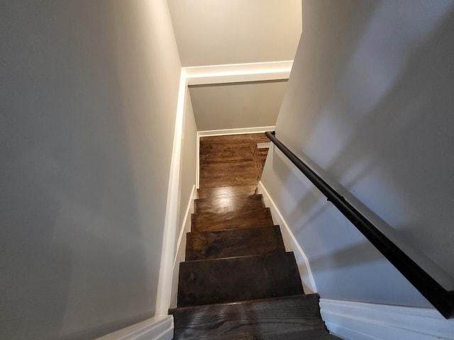 stairs with wood finished floors