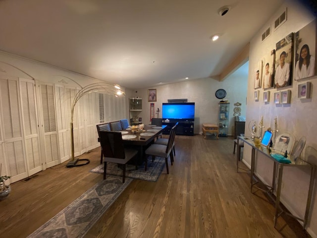 dining room featuring wood finished floors and visible vents