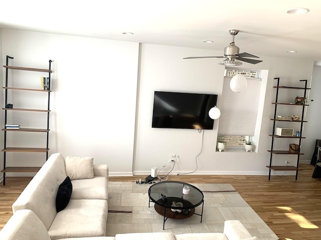 living room with recessed lighting, baseboards, a ceiling fan, and wood finished floors