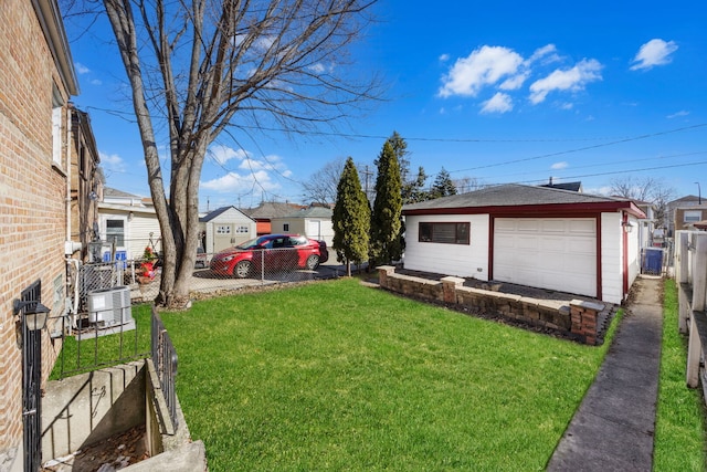 view of yard with an outbuilding, cooling unit, fence, and a residential view