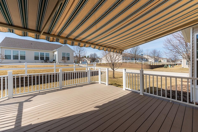 wooden terrace with a residential view