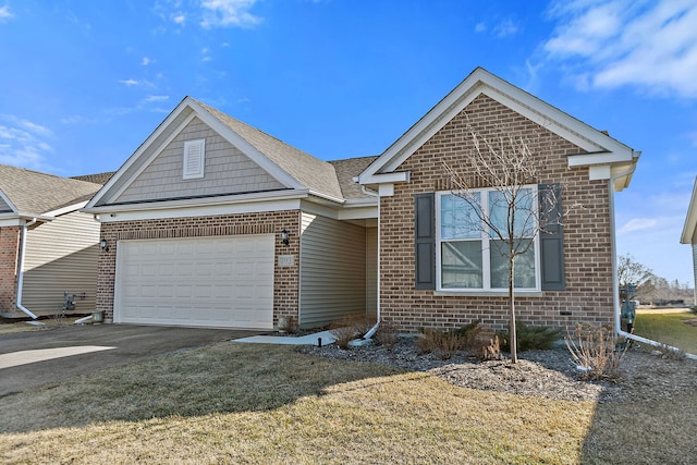 view of front of property with aphalt driveway, brick siding, and a garage