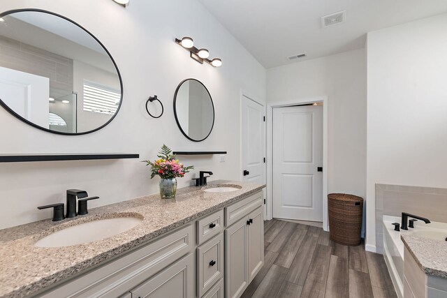 living room featuring recessed lighting, visible vents, baseboards, and light wood finished floors