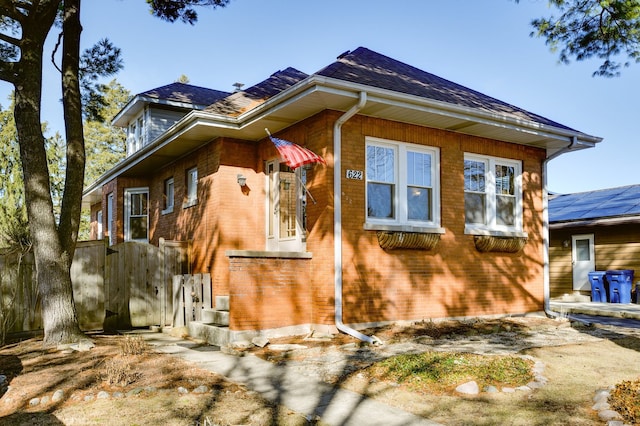 view of side of home featuring brick siding