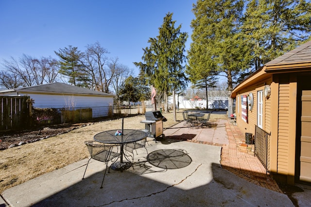 view of patio with a fenced backyard, area for grilling, and outdoor dining space