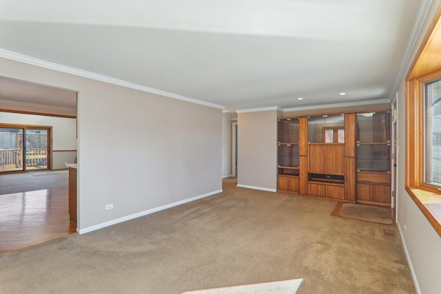 unfurnished living room featuring carpet flooring, recessed lighting, baseboards, and ornamental molding