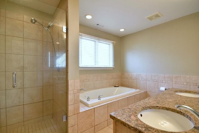 full bath with a sink, visible vents, and a stall shower