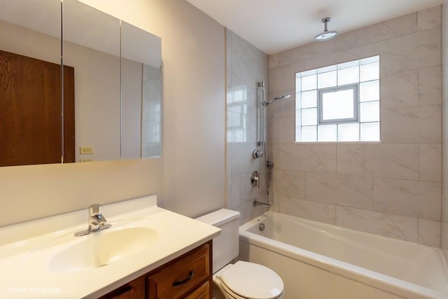 bathroom featuring tub / shower combination, vanity, and toilet