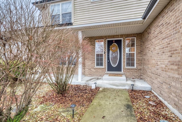 entrance to property with brick siding