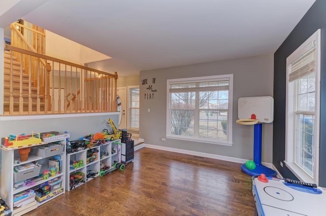 rec room with wood finished floors and baseboards