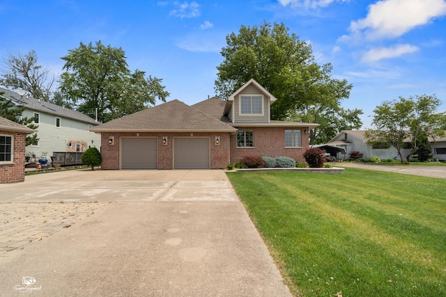 8043 Tamarack Ln, Morris, IL 60450 - view of front of house with brick siding, a front lawn, an attached garage, and concrete driveway