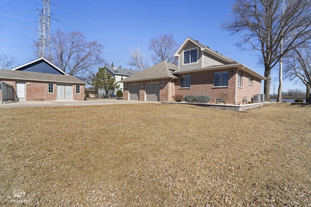 view of front of home with brick siding, a front lawn, an attached garage, and central air condition unit