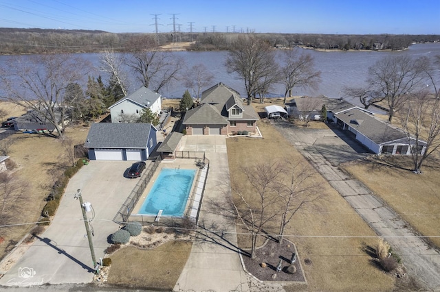 birds eye view of property with a water view