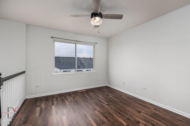 empty room featuring visible vents, baseboards, ceiling fan, and wood finished floors