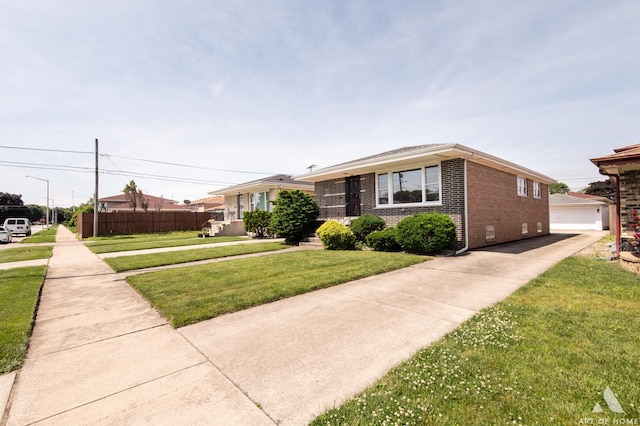 view of front of home with crawl space, brick siding, a front yard, and fence