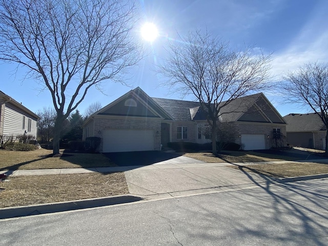 view of front of property featuring a garage and driveway