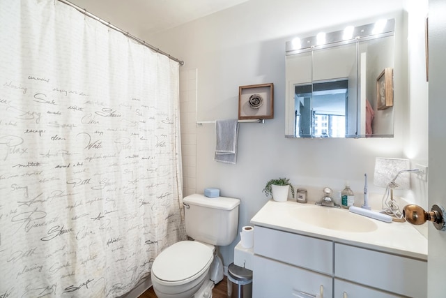 full bath with a shower with curtain, toilet, and vanity