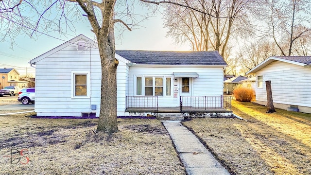 bungalow with a shingled roof