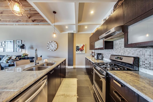 kitchen featuring under cabinet range hood, decorative backsplash, stainless steel appliances, and a sink