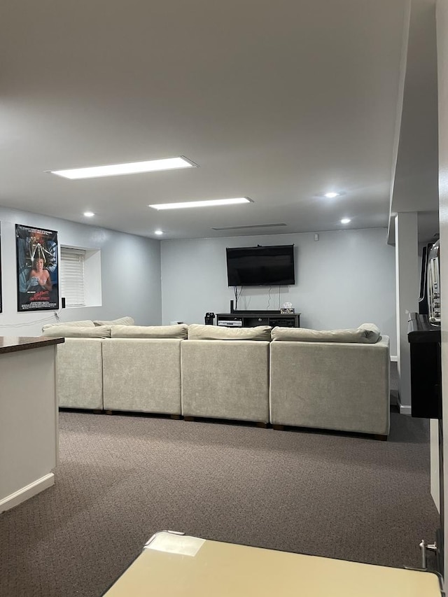 living area featuring recessed lighting, baseboards, and carpet