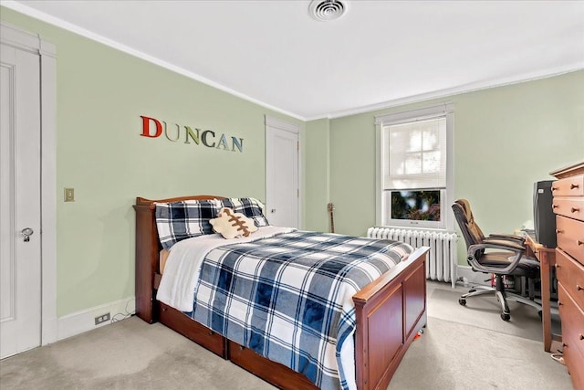 bedroom with visible vents, radiator, crown molding, baseboards, and light carpet