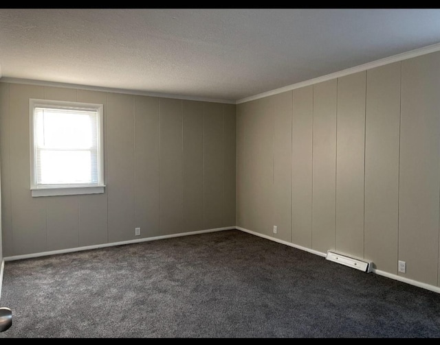 carpeted empty room with a textured ceiling, visible vents, and ornamental molding