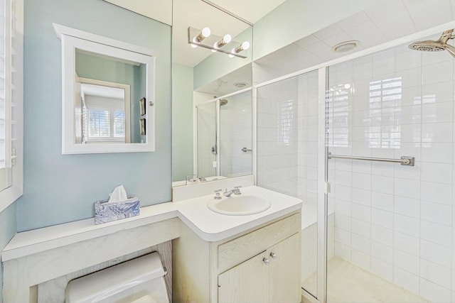 bathroom featuring vanity and a stall shower