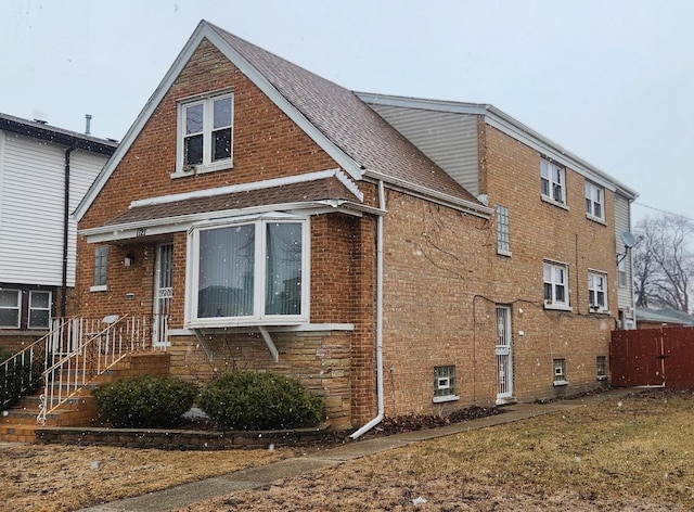 view of property exterior featuring brick siding