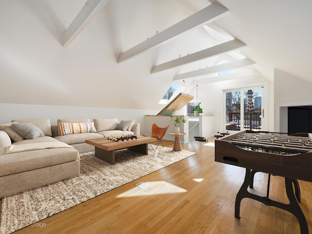 rec room featuring vaulted ceiling with beams and wood finished floors