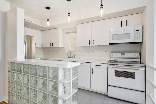 kitchen with white appliances, light tile patterned floors, a sink, light countertops, and white cabinetry