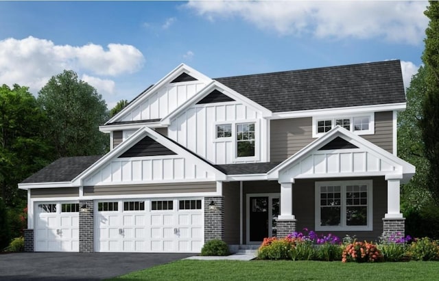 view of front of house featuring board and batten siding, an attached garage, driveway, and a shingled roof