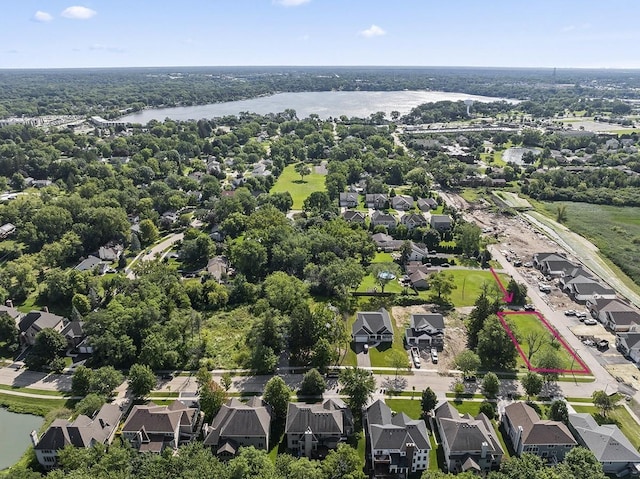 birds eye view of property featuring a water view and a residential view