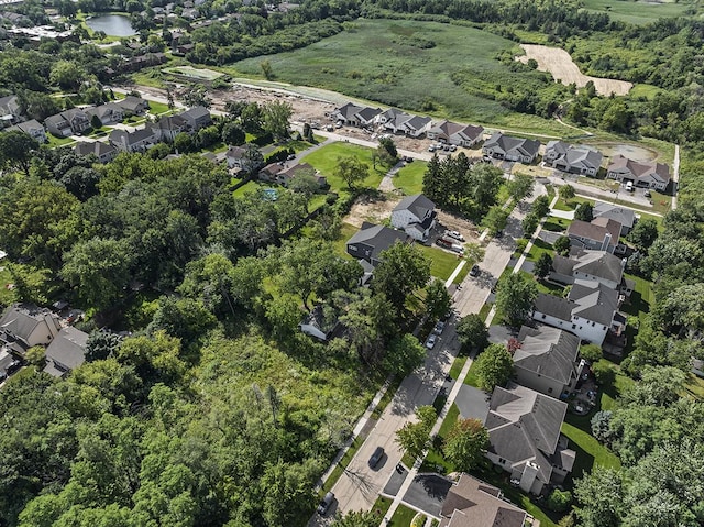 bird's eye view featuring a residential view and a water view